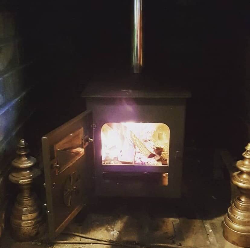 How to install a wood burning stove in a fireplace?